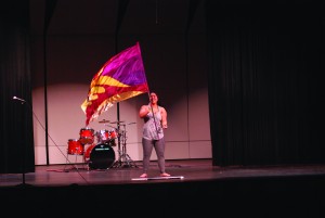 Senior Victoria Luu performs a color guard routine at the third annual talent show. While the color guard only competes during the fall sports season, the talent show provided an opportunity for Luu to continue her skills out of the regular season.