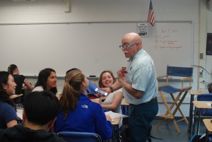 In bright blue glasses, English teacher Steven Klass teaches his freshmen section. “It’s always of interest to me to see the way that kids in my classes perceive things,” Klass sai