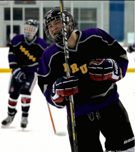 Junior Stephen Arthur celebrates after scoring his second goal in the game against Yorktown on Jan. 9. The Bruins won the game 10–2.