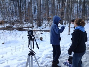 Senior and IB Film student Ellen Rank, right, bears the winter cold along with her actors (sophomore John Laszakovitz, left, and senior Tommy Neidecker) as she shoots her film Icarus for the film festival. The filmmaker tried to use the winter setting to her advantage in the making of their film.