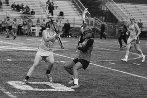 Sophomore Hannah Smith blocks an Edison High School player at the varsity girls lacrosse conference championship game on  May 21. The game ended in 15 - 5 victory for the Statesmen.  