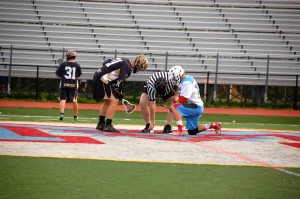 Sophomore Noah Adler gets in position for the faceoff during   the boys varsity lacrosse home game against the Trinity School at Meadow View.  The Statesmen beat Trinity 23-6 on May 1.  