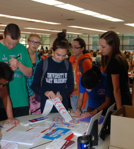 Senior Samantha Van Heest Alana Hassett and Sarah Zhu pledge their registration to vote during D lunch. The drive had four people register to vote and 56 people pledge to vote at the end of the drive. Any student who turns 18 between Nov 4 and Nov 8 is eligible to vote.