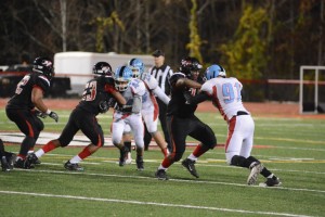  Senior Joshua Hurlburt runs the ball in the Nov. 13 tournament game.