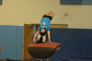 Sophomore Megumi Matsuda-Rivera performs a vault during a Nov. 16 practice. The gymnastics team's first meet will take place Dec. 7.