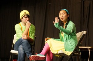 Senior Chris Chapin and sophomore Emma Choi mull over and discuss complicated questions in a short skit entitled “21-22” which parodies the antics of popular game shows such as Who Wants To Be A Millionaire? The scene was just one component of the dynamic theater production Fat Kids are Harder to Kidnap, which consisted of 20 skits that were performed in rapid succession in a sequence decided by the audience. The show is unique in its extensive use of audience participation to move the plot along, an idea not commonly seen in theatrical productions.