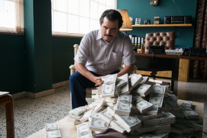 Pablo Escobar, played by Wagner Mourna, contemplates over a pile of drug money in Narcos. Narcos features exceptionally diverse casting in the main roles, which Netflix has gained a reputation for.
