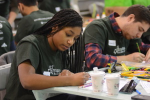 Senior Ash Lee Manley writes a holiday card.