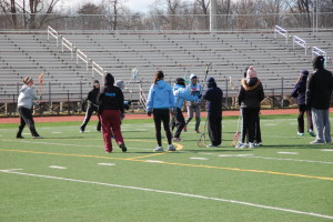 Girls lacrosse practices in the cold on Feb 13. The team has been holding regular training during the off season in which they work on fundamentals and scrimmage in order to prepare for tryouts in the spring season.