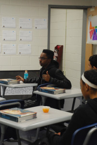 BSU executive board member and senior Moe Khaled speaks to the club about the deadly levels of lead poisoning in Flint, Michigan. Members then brainstormed flyer designs that promoted their upcoming water bottle drive