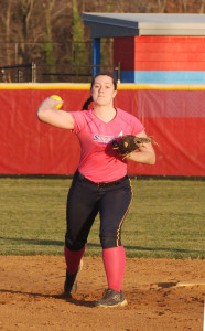 Senior Madison Larsen throws the ball to her teammate while covering her own base during a practice on March 11. The play was part of a cooperative training drill intended to increase speed and reflexes.