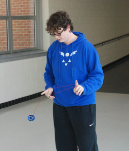 Sophomore Alexander Swift demonstrates his favorite yo-yo trick, 'the Matrix.' "It's a repeater actually, where you end where you begin so you can just keep doing it in a sequence forever until you run out of spin," Swift said.