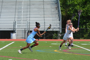 Sophomore Setota Tesfu carries the ball up the field through the Potomac Falls defense during the State Championship Game on May 11, The Statesmen lost to the Panthers 7-19.