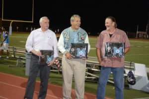 Alumni John Herbots, Jim Murray and Dusty Kuzma hold their awards at the Hall of Fame ceremony.