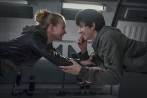 Tulsa (Britt Robertson) and Gardner (Asa Butterfield) float in mid-air onboard a space ship. The movie’s main conflict stems from Gardner’s inability to survive in Earth’s conditions.