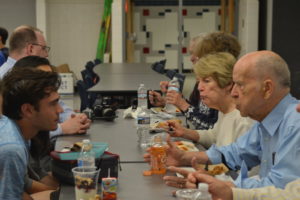 Junior Chris Margiotta speaks with original Principal Elam Hertzler over lunch on June 6.