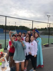 Girls varsity tennis coach Arlene Fitz-Patrick poses for a selfie with her team after winning the Capitol Conference.