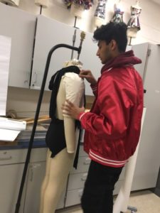 Senior Mohit Sahgal prepares his clothing line for a fashion show that will take place at George Mason University. “I’m so excited because my first clothing line ever is going to be premiered,” Sahgal said.