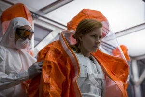 Dr. Louise Banks (Amy Adams) suits up with protective gear and gets ready to communicate with the alien species featured in the movie.