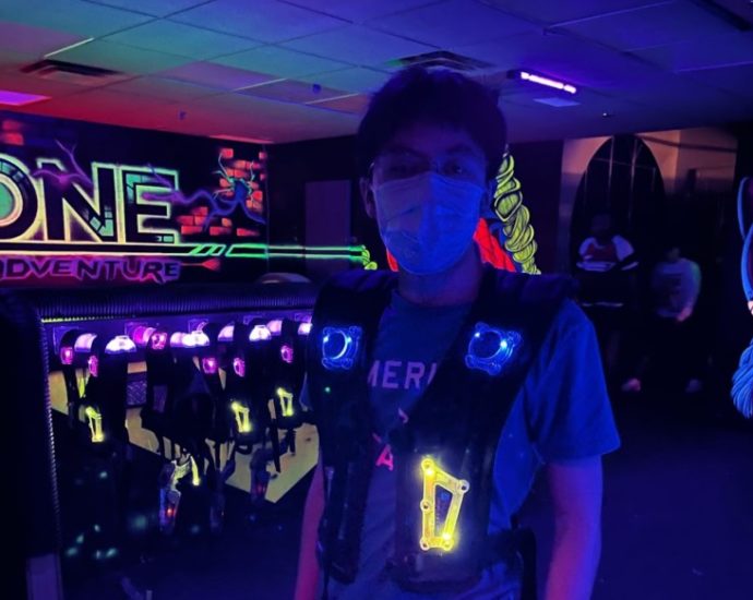 Junior David Tu poses at a laser tag event.